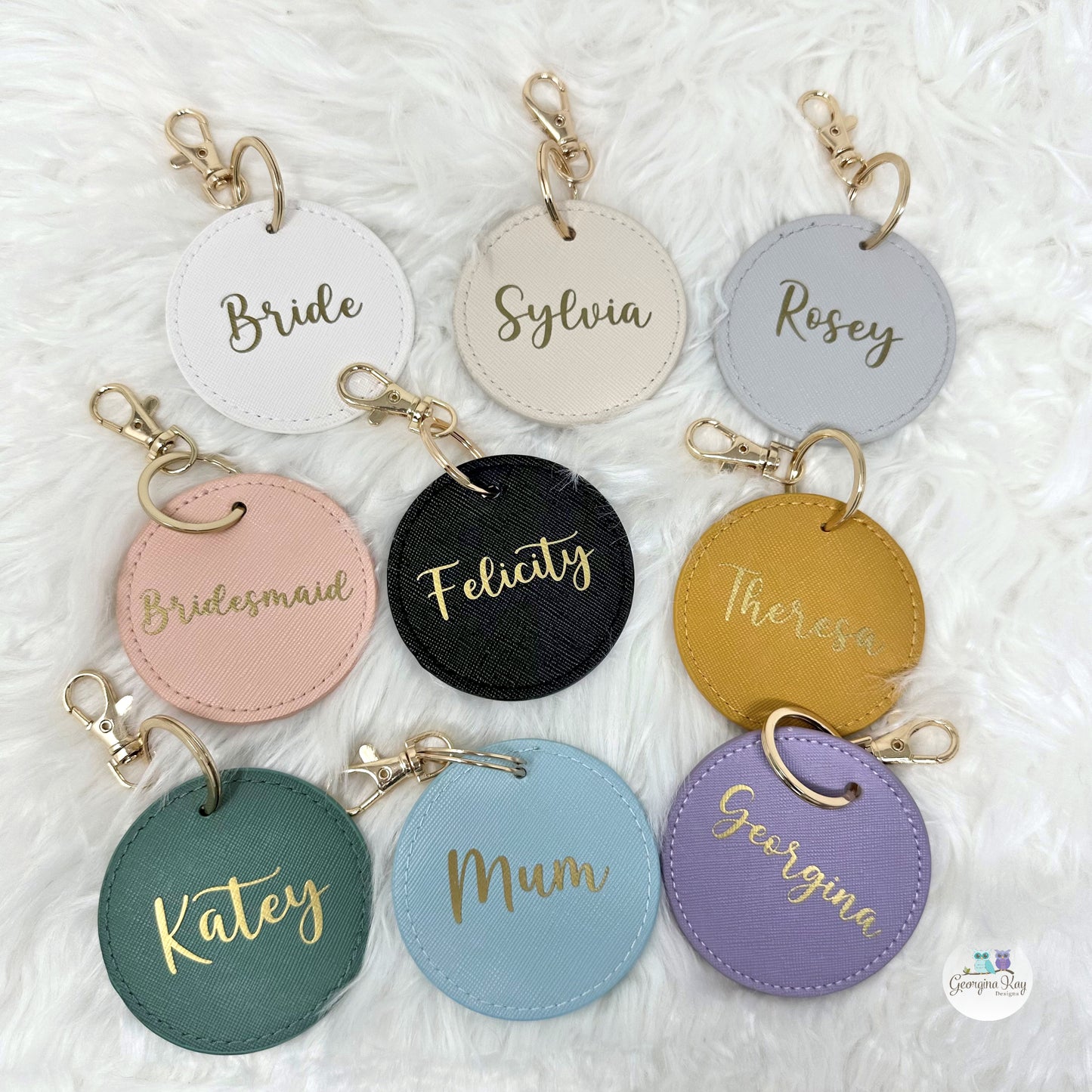 Set of personalized keychains with names on a textured white background