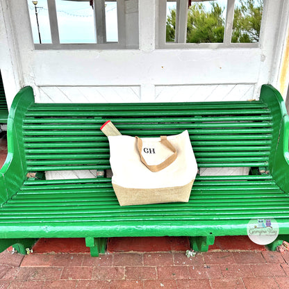 Green bench with a tote bag 