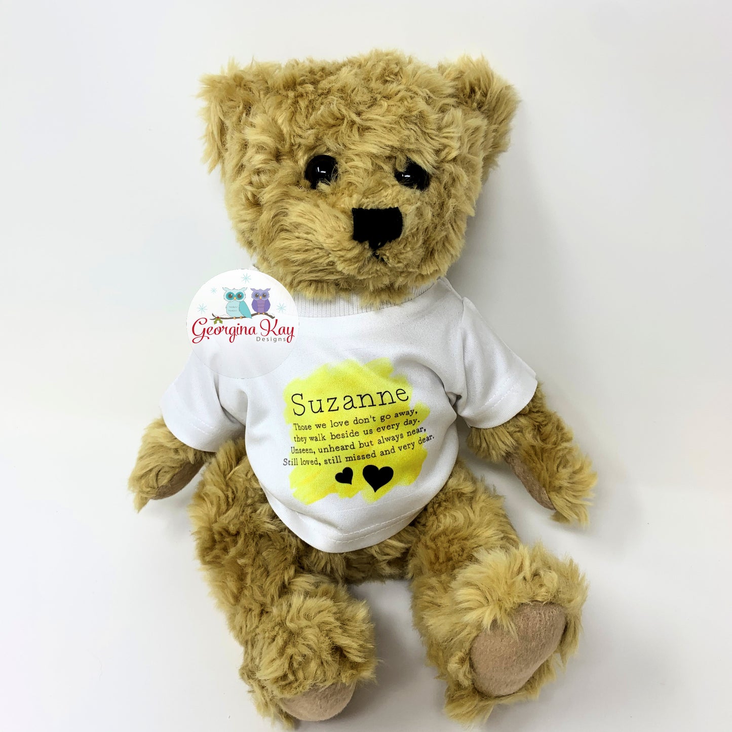 Teddy bear wearing a white shirt with text and graphics on a white background