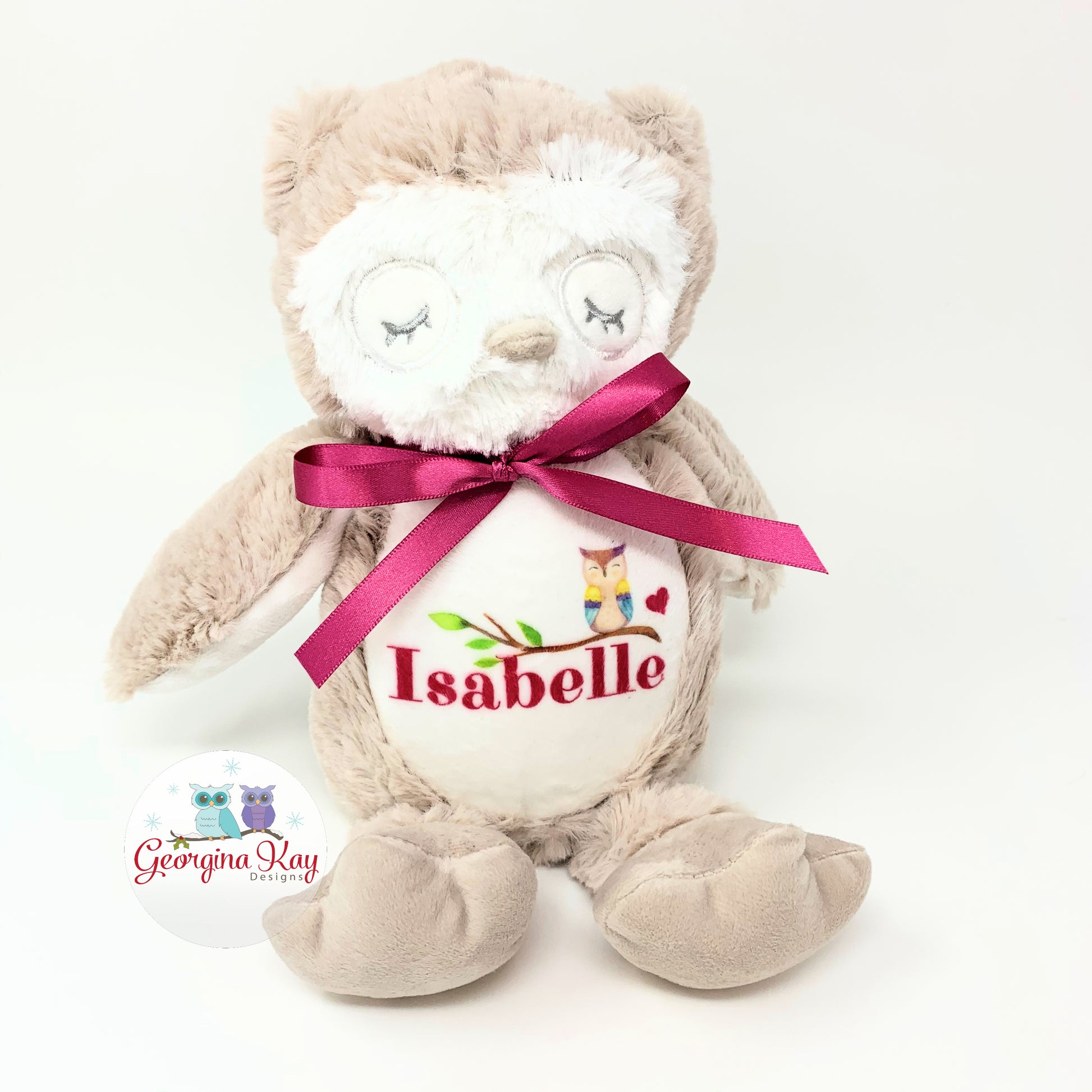 Plush owl toy with a pink ribbon and personalized name on a white background