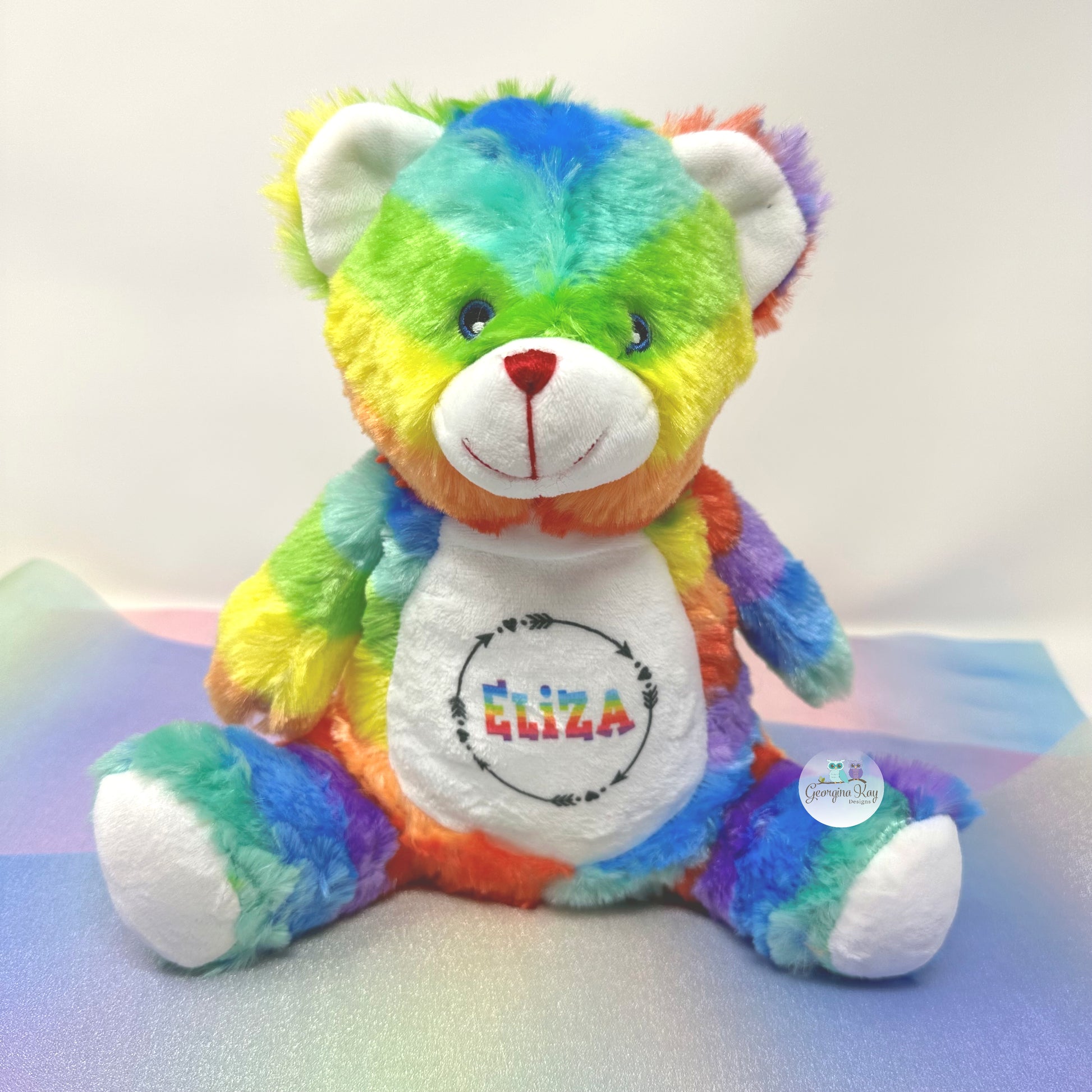 Colorful teddy bear with 'Eliza' on a white background