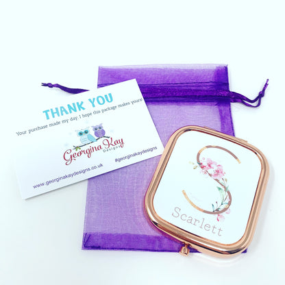 Compact mirror with floral design and 'Scarlett' text, placed on a purple drawstring bag with a 'Thank You' card from Georgina Kay Designs.